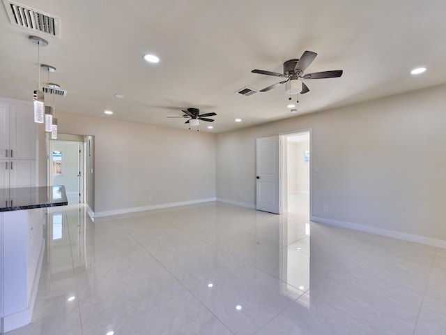 empty room featuring ceiling fan