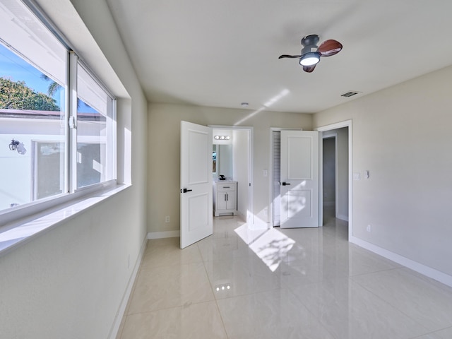 unfurnished bedroom featuring ceiling fan