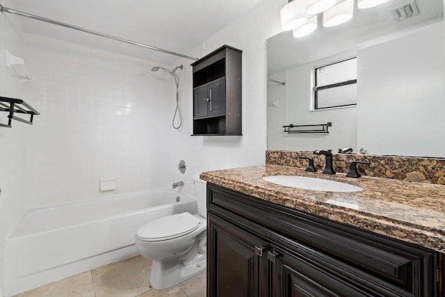 full bathroom with tile patterned floors, vanity, toilet, and tiled shower / bath combo