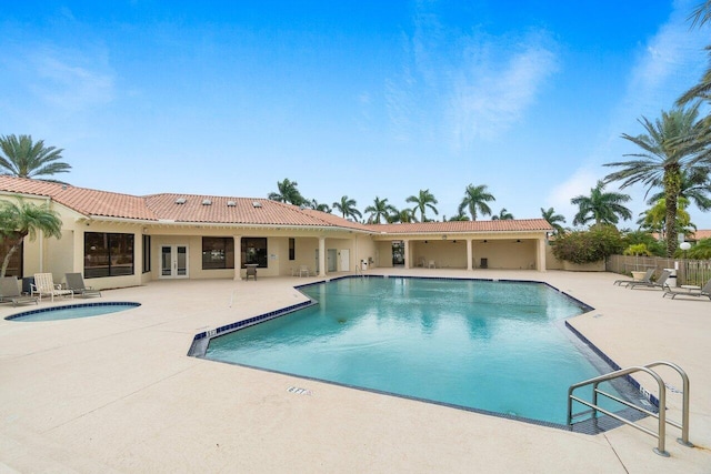 view of swimming pool featuring a patio area