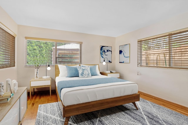 bedroom with hardwood / wood-style floors