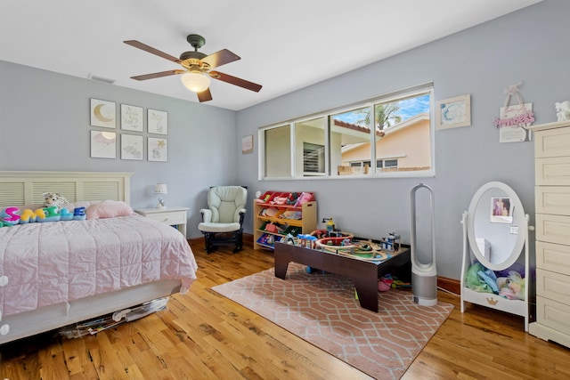 bedroom featuring light wood-type flooring and ceiling fan