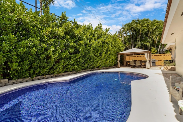 view of pool featuring a gazebo and a patio