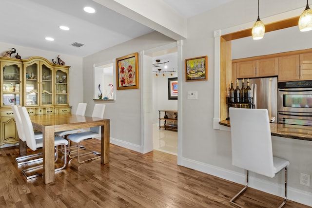 dining area with dark wood-type flooring