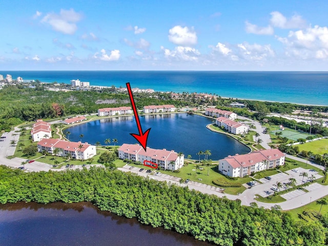 birds eye view of property featuring a water view