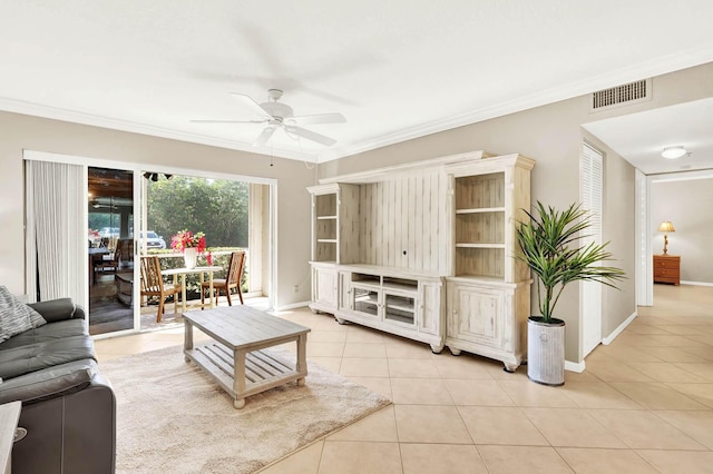 tiled living room featuring ceiling fan and ornamental molding