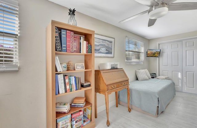 living area with ceiling fan