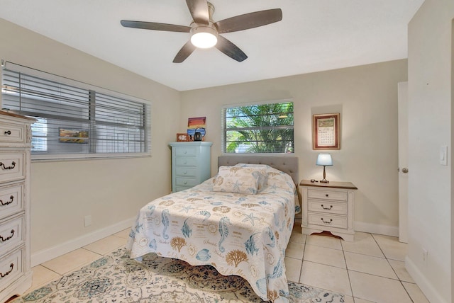 tiled bedroom with ceiling fan