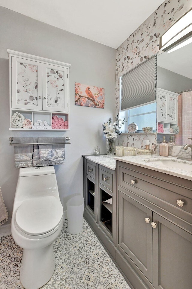 bathroom featuring vanity and toilet