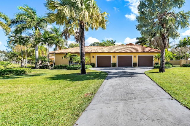 mediterranean / spanish-style house with a front yard