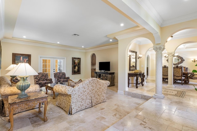 living room featuring decorative columns, ornamental molding, and french doors