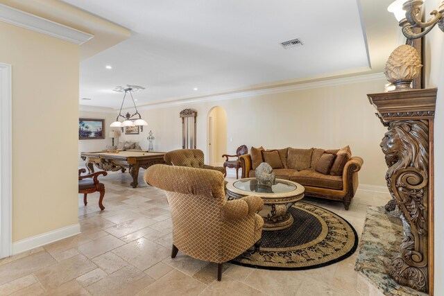 living room featuring ornamental molding and pool table