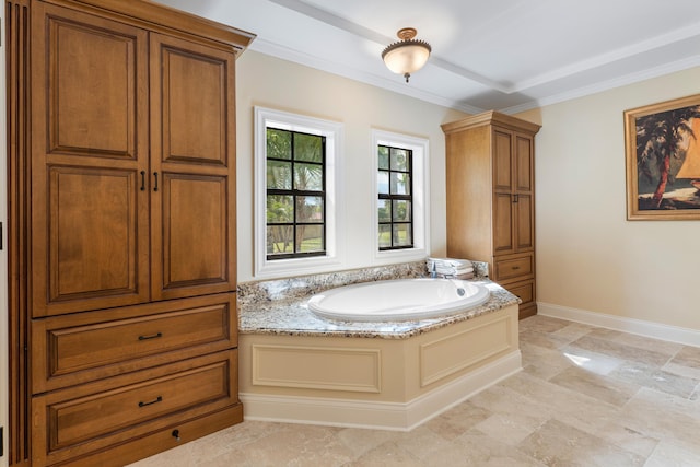 bathroom featuring a tub to relax in and ornamental molding