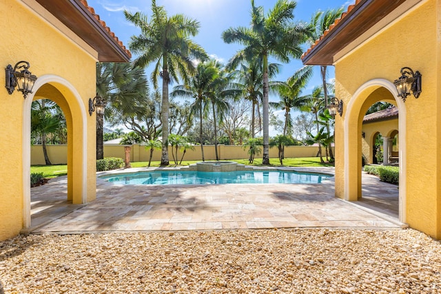 view of pool featuring an in ground hot tub and a patio area