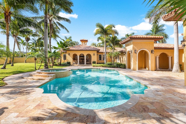 view of swimming pool featuring an in ground hot tub and a patio