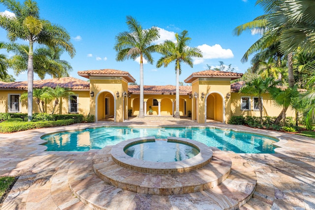 view of pool featuring an in ground hot tub and a patio area