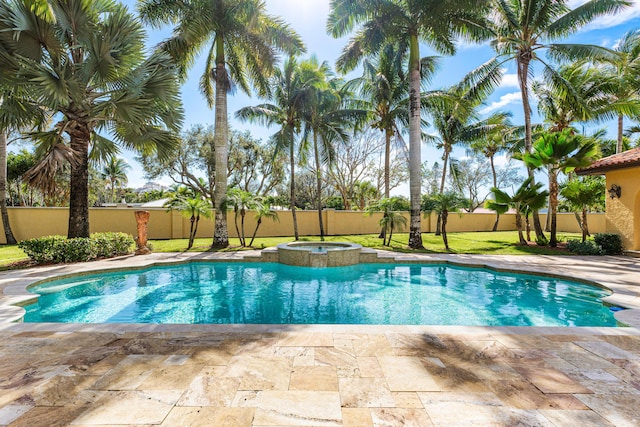 view of swimming pool featuring a patio area and an in ground hot tub