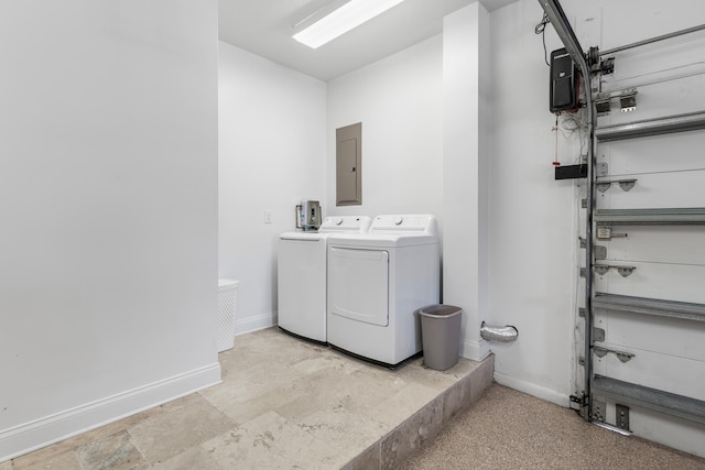 clothes washing area with electric panel and washer and clothes dryer