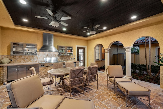 view of patio with ceiling fan, area for grilling, grilling area, and sink