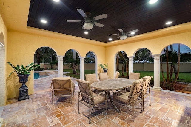 view of patio featuring a fenced in pool and ceiling fan