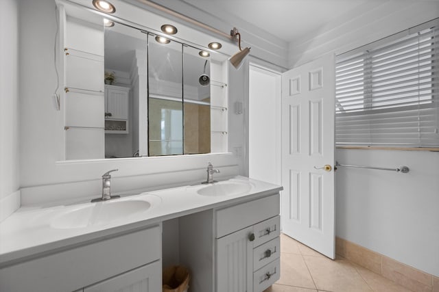 bathroom with tile patterned floors and vanity