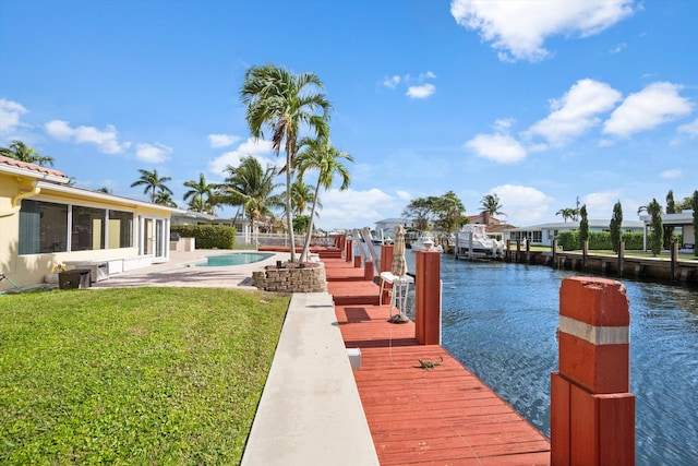 dock area featuring a yard and a water view