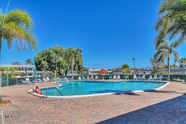 view of swimming pool with a patio