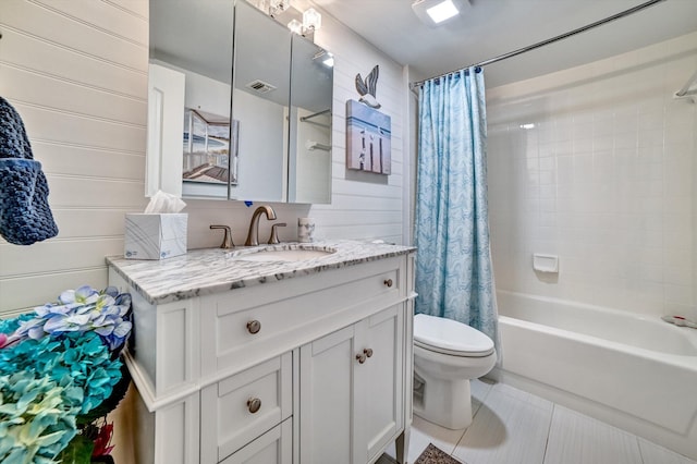 full bathroom with tile patterned flooring, shower / tub combo with curtain, wooden walls, and toilet