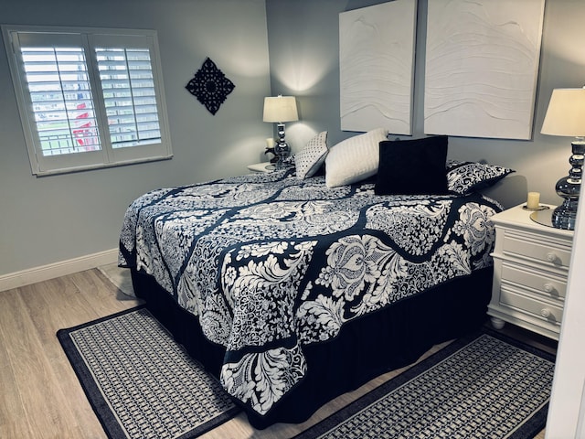 bedroom with light hardwood / wood-style floors