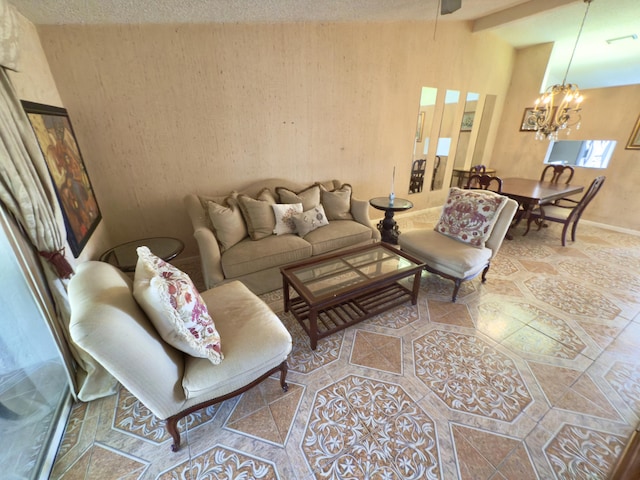 living room featuring a notable chandelier and a textured ceiling