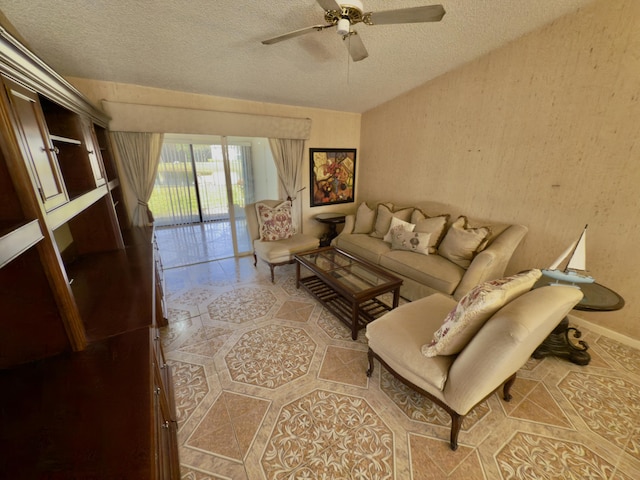 living room featuring a textured ceiling and ceiling fan