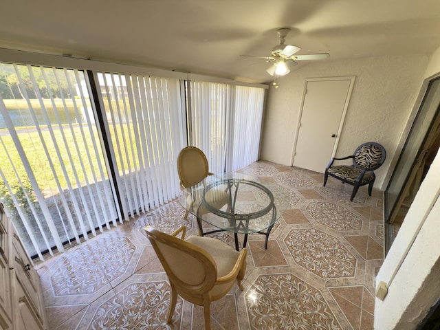 living area featuring ceiling fan