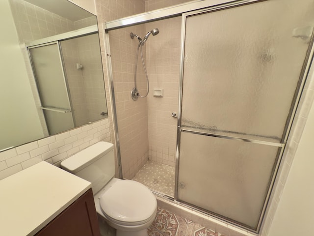 bathroom featuring decorative backsplash, toilet, tile walls, and a shower with shower door