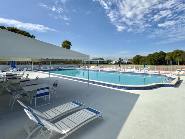 view of swimming pool with a patio