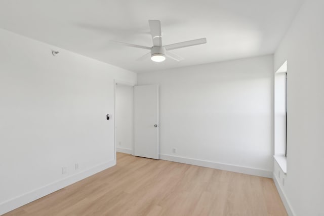 empty room featuring light wood-type flooring and ceiling fan