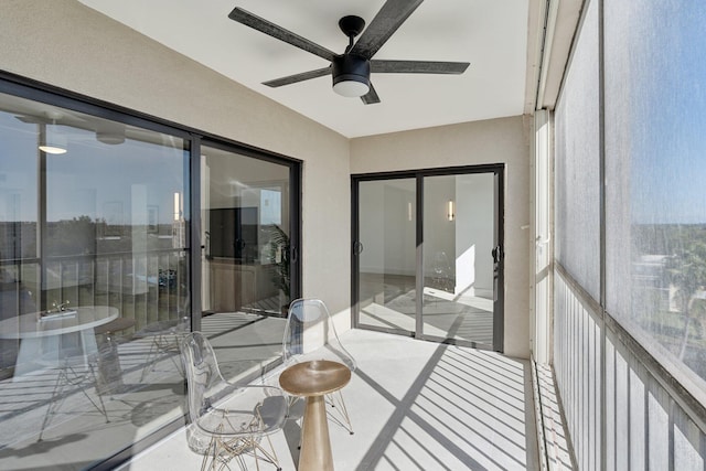 sunroom featuring ceiling fan