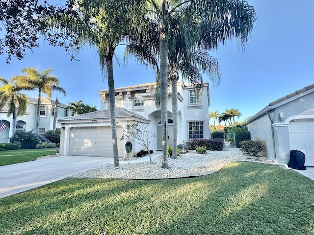 view of front of home featuring a front yard and a garage