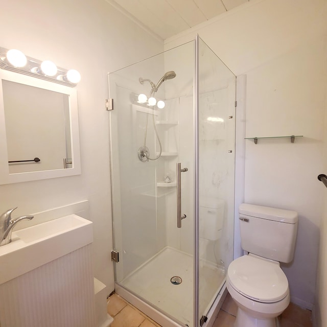 bathroom with toilet, tile patterned floors, walk in shower, and vanity