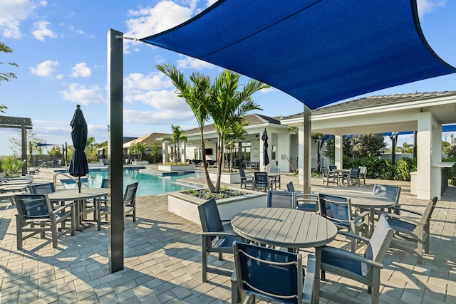 view of patio featuring a community pool