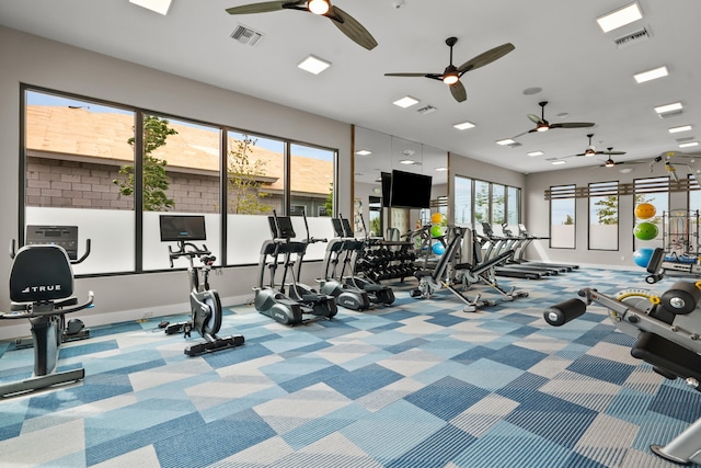 workout area featuring carpet floors, visible vents, and baseboards