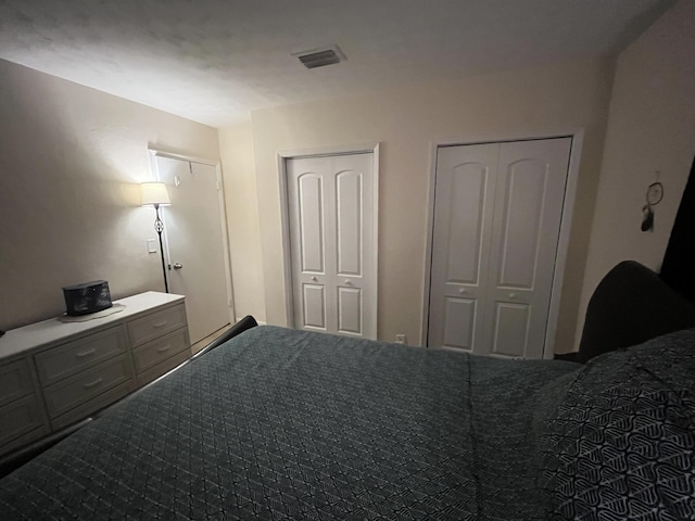 bedroom featuring two closets