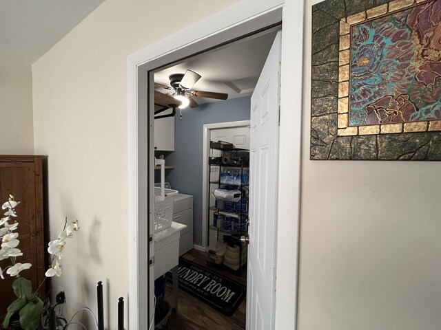 laundry area featuring cabinets, separate washer and dryer, and sink