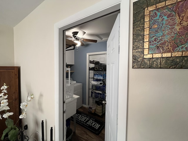 interior space with hardwood / wood-style flooring, ceiling fan, and washing machine and dryer