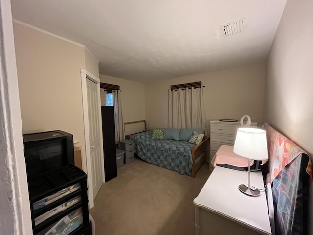 bedroom with carpet floors and a closet