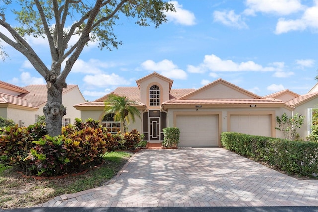 mediterranean / spanish-style house featuring a garage