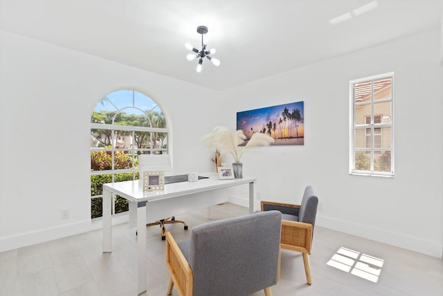 office featuring a notable chandelier and a wealth of natural light