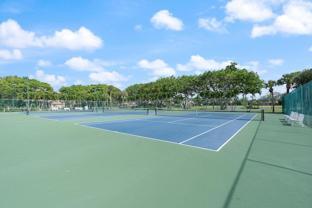 view of sport court with basketball hoop