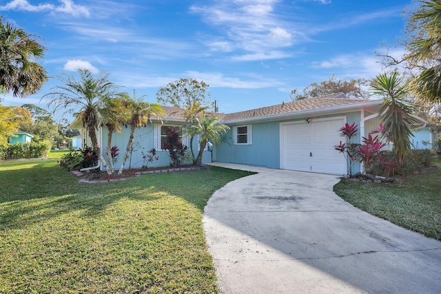 ranch-style home with a garage and a front lawn