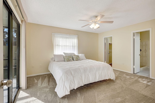 bedroom featuring light carpet, ceiling fan, and a textured ceiling