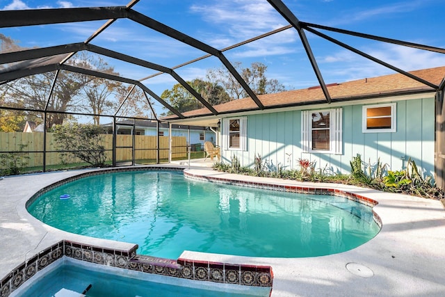 view of swimming pool with a lanai and a patio